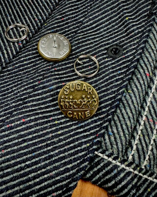 Lot No. SC15446
“13.7oz. INDIGO NEP DENIM WORK VEST”
An original 13.7oz. indigo neppy denim featuring a warp yarn of rope-dyed indigo and a weft yarn of grey with colored nep. The design involves removing the sleeves of a 1940s Headlight Engineer Jacket and adding a back strap for waist adjustment. The front features change-button specifications.
 
#SugarCaneDenim #ToyoEnterprise #FictionRomance #MadeinJapan